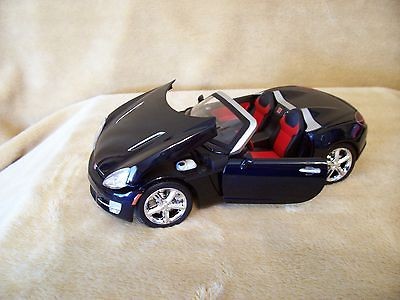 24 DIECAST MOTORMAX BADDRIDE 2006 SATURN SKY DARKBLUE BLACK CONV.