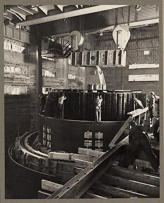 Norris Dam,Tenn. 1935 40? Workmen in the dam powerhouse installing a 