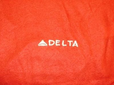 Delta Air Lines Domestic First Class Red blankets with Delta Brand 