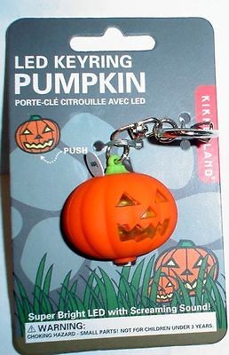 pumpkin key chain with light up face and laughing sound