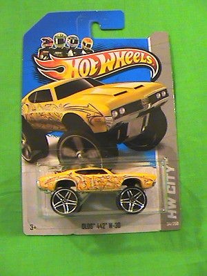 HOT WHEELS OLDS 442 W 30 GRAFFITI RIDES HW CITY 2013 YELLOW CAR NEW 