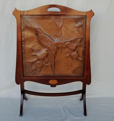  fireplace screen mahogany frame and stand is inset with a hand tooled