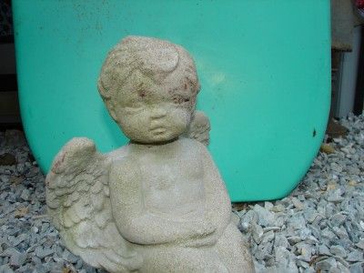 vintage concrete angel sitting on flower stump mold