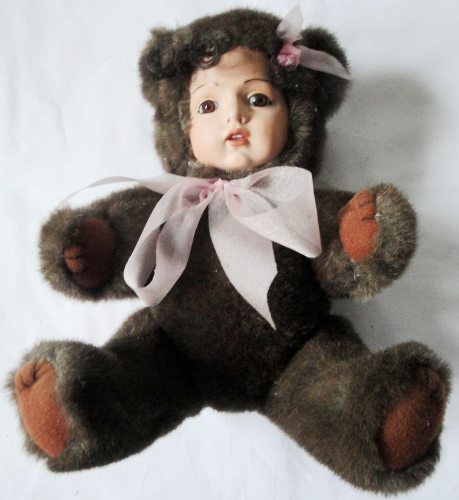 teddy bear with doll face