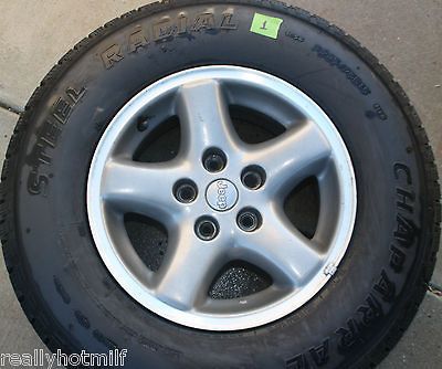 XJ Cherokee OEM 5 Spoke Alloy Wheel W/Tire 235/75R15 5 AVAIL Good Cond